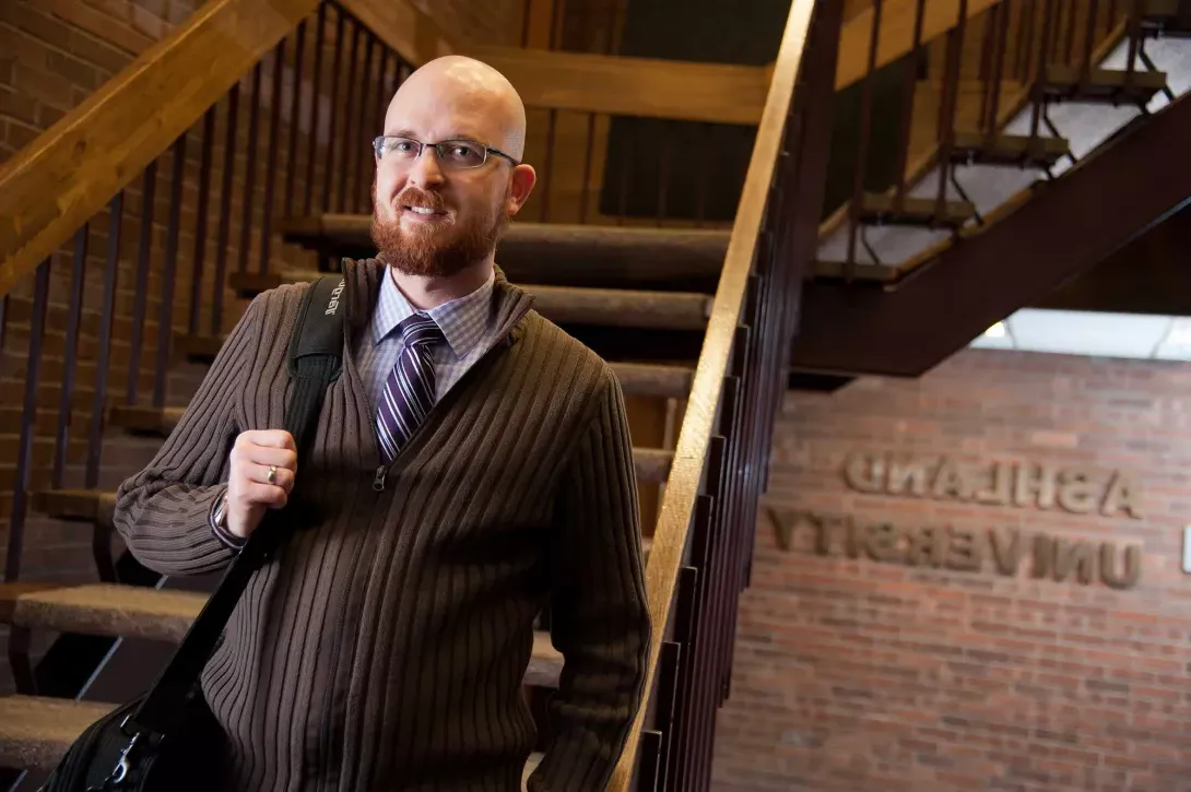 MBA student walking down stairs